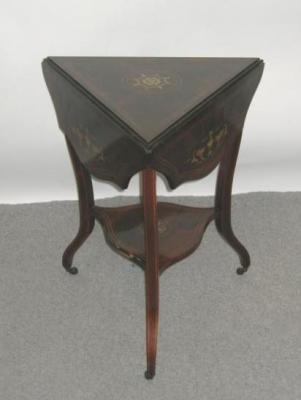 Appraisal: A LATE VICTORIAN ROSEWOOD OCCASIONAL TABLE of triangular form with