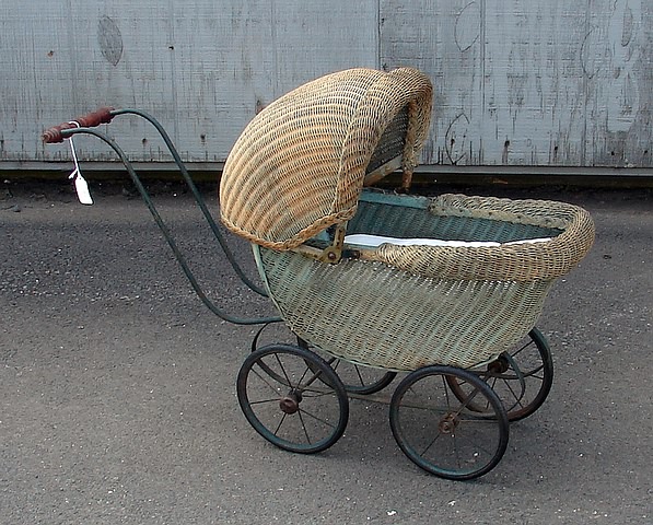 Appraisal: Carriage Faded green paper wicker doll carriage with adjustable hood