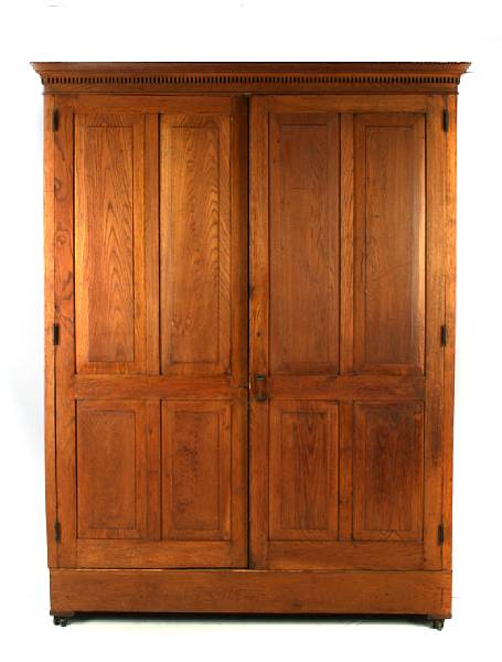 Appraisal: An Arts and Crafts oak wardrobe height ft in width