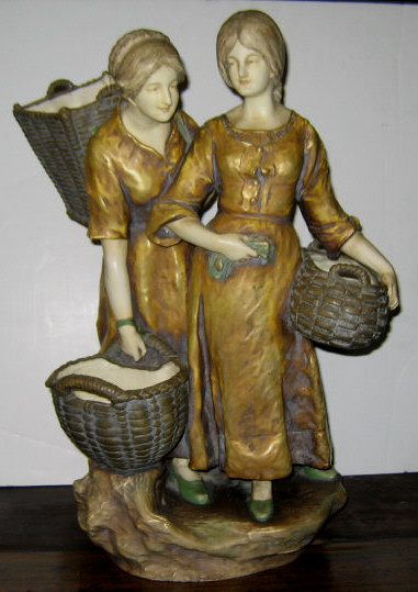 Appraisal: AMPHORA POTTERY FIGURE GROUP Showing two women with baskets wearing