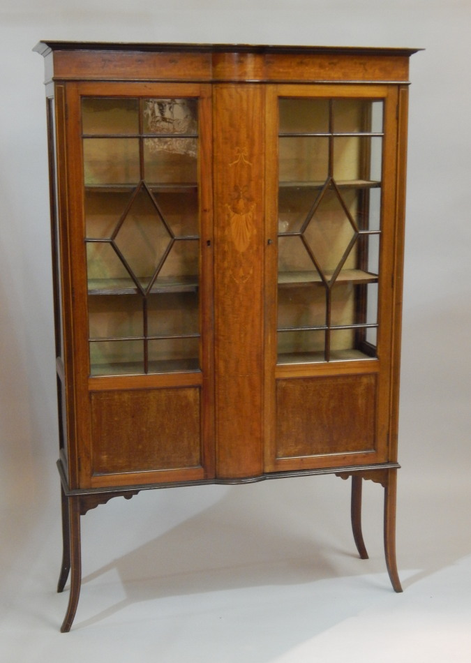 Appraisal: An Edwardian mahogany and marquetry display cabinet with two astragal