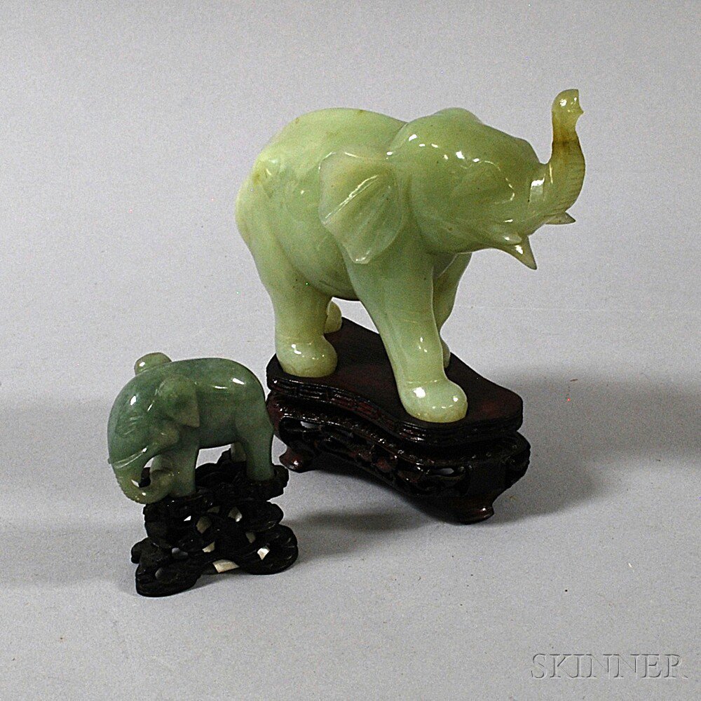 Appraisal: Two Chinese Pale Green Hardstone Elephants th century on carved