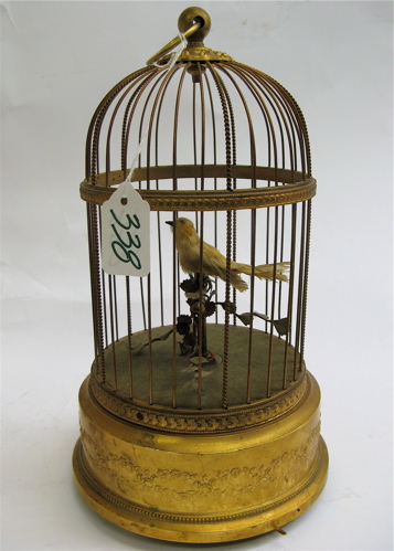 Appraisal: FRENCH MECHANICAL MUSICAL BIRD IN CAGE the gilt metal base