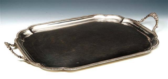 Appraisal: A GEORGIAN STYLE SILVER TWO HANDLED BUTLER'S TRAY with scallop