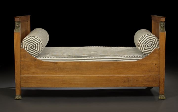 Appraisal: Empire-Style Fruitwood Daybed late th century the headboard and footboard