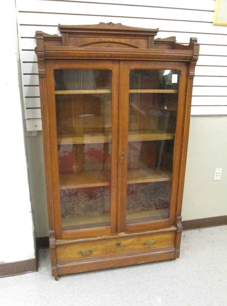 Appraisal: VICTORIAN WALNUT CABINET BOOKCASE Charles Eastlake design American c having