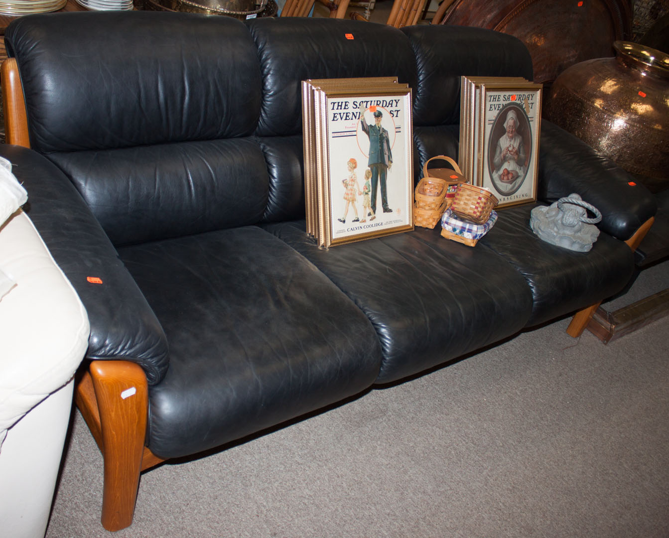 Appraisal: a Leather and wood sofa