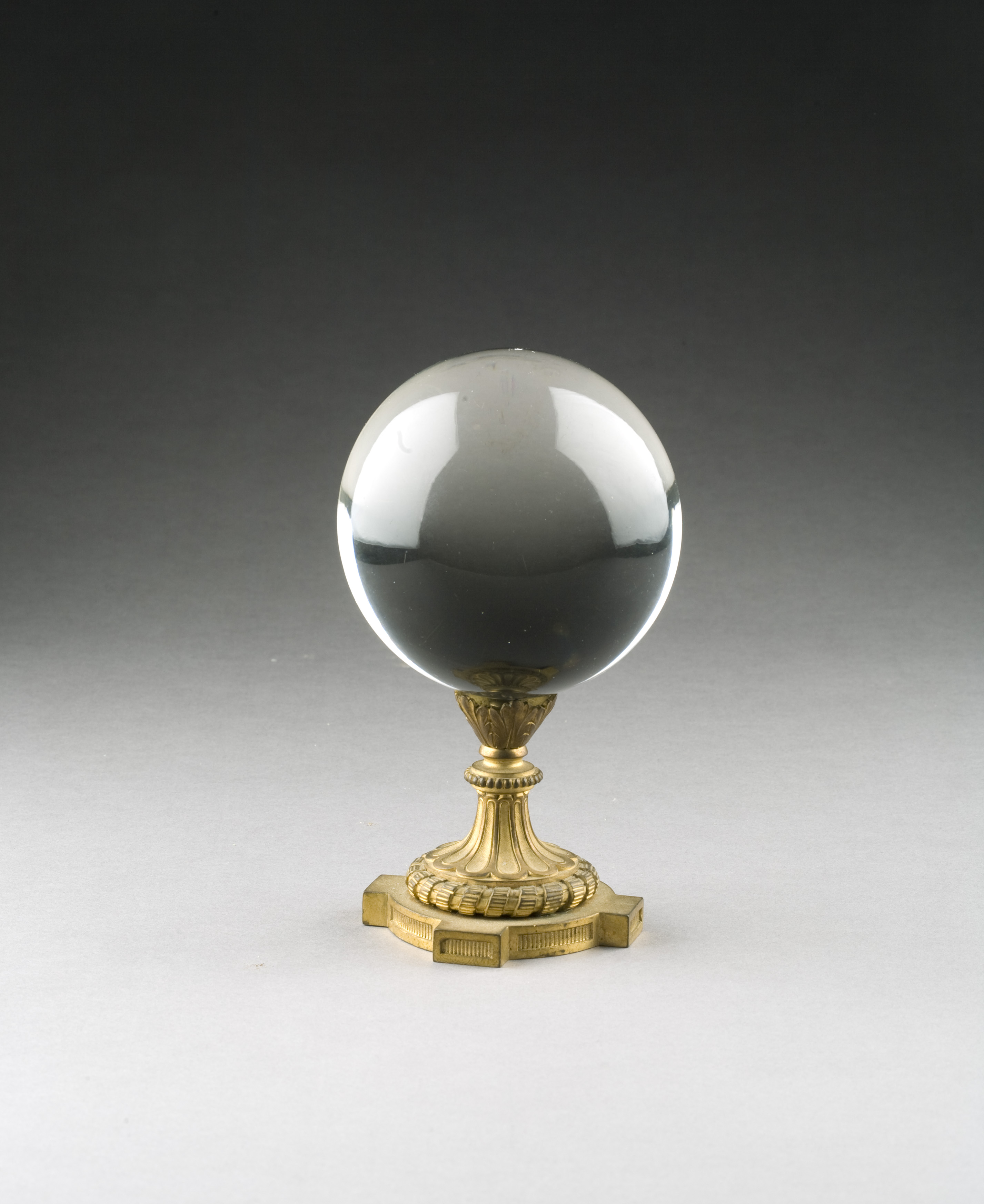 Appraisal: SPHERICAL CRYSTAL BALL MOUNTED ON A CLASSICAL ORMOLU STAND Height