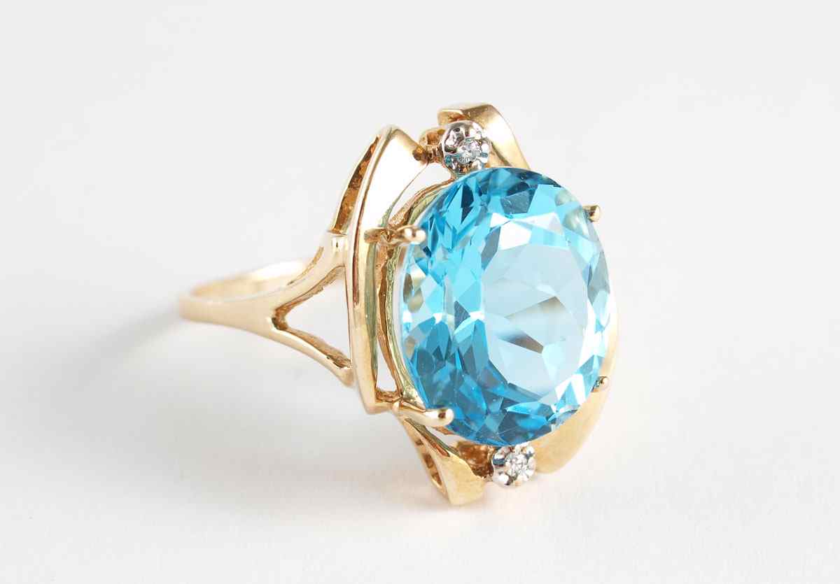 Appraisal: CT SWISS BLUE TOPAZ RING WITH DIAMONDS K yellow gold