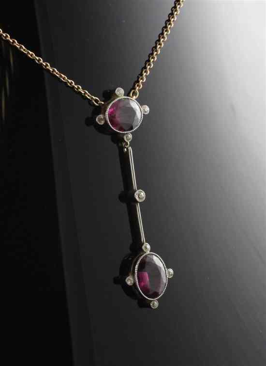 Appraisal: An Edwardian diamond and garnet set gold drop pendant in