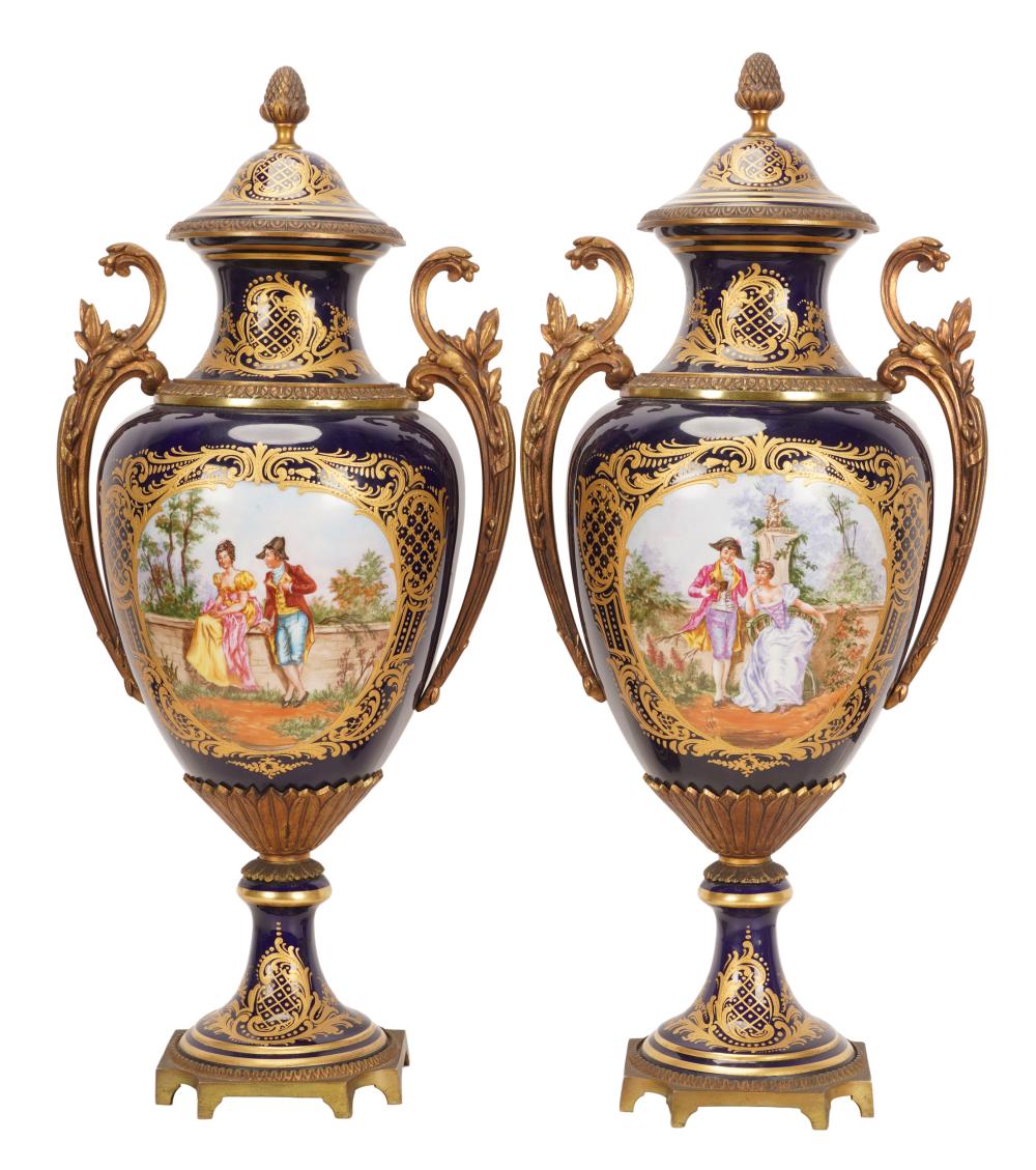 Appraisal: PAIR OF SEVRES-STYLE PORCELAIN URNSeach with interlaced L mark each