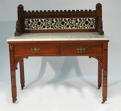 Appraisal: An inlaid mahogany wash stand in the style of Charles