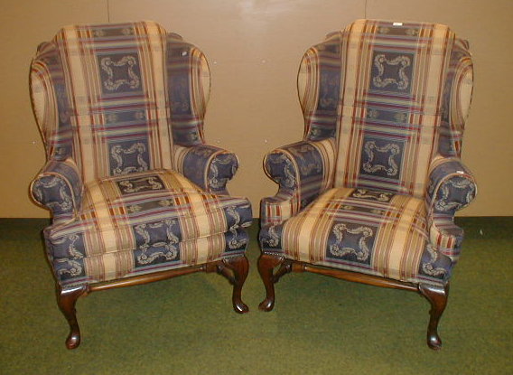 Appraisal: A pair of modern upholstered wing armchairs in George I