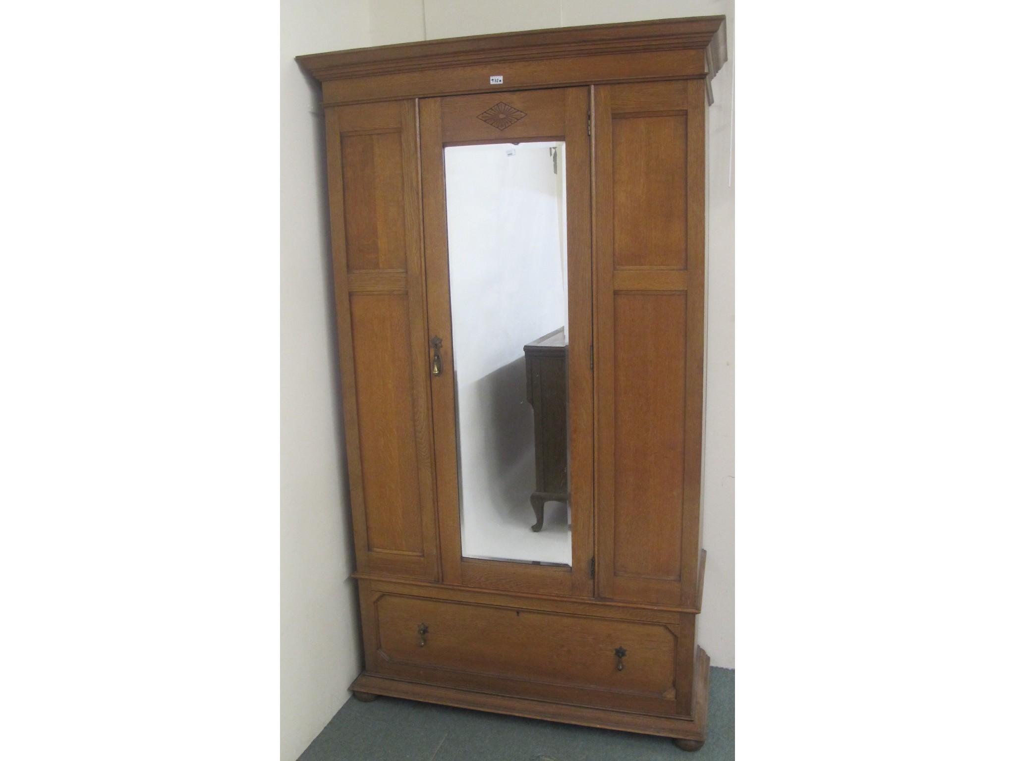 Appraisal: An oak mirrored door wardrobe