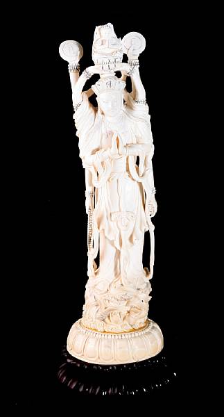 Appraisal: A tinted ivory figure of a multi-armed guanyin th Century