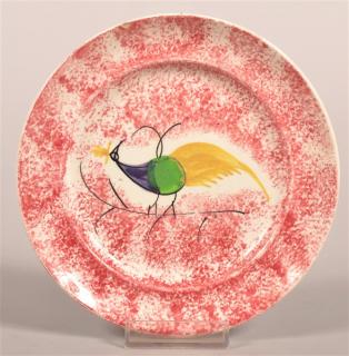 Appraisal: Red Spatter Peafowl Pattern Plate Purple green and yellow peafowl