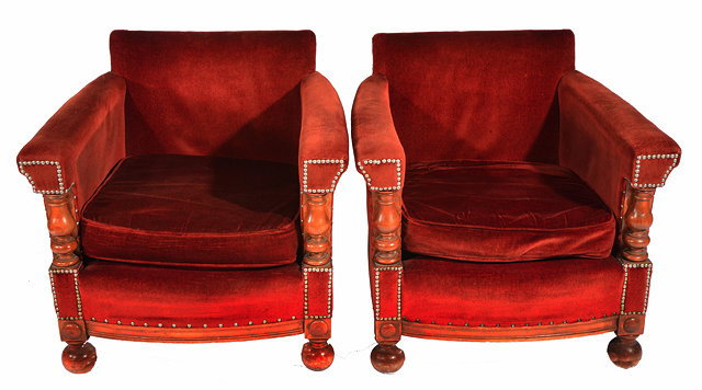 Appraisal: A PAIR OF EDWARDIAN CLUB ARMCHAIRS with rust coloured Draylon