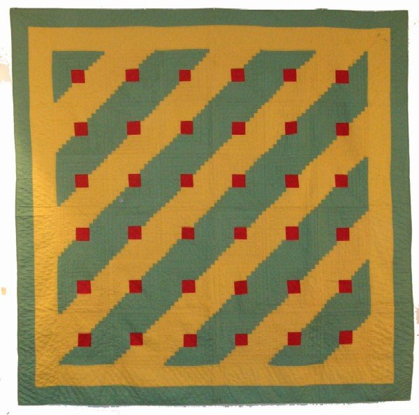 Appraisal: Quilt in the log cabin pattern Yellow and green with