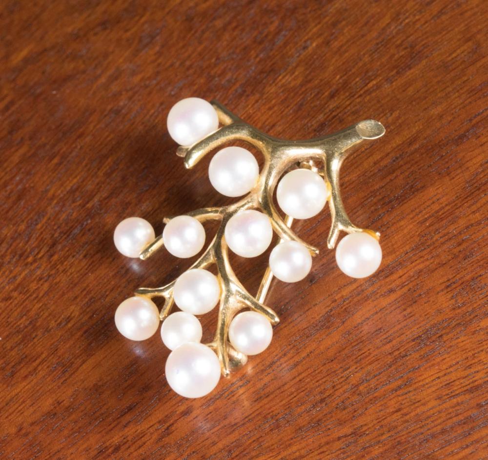 Appraisal: MIKIMOTO AKOYA PEARL AND FOURTEEN KARAT GOLD PIN The tree