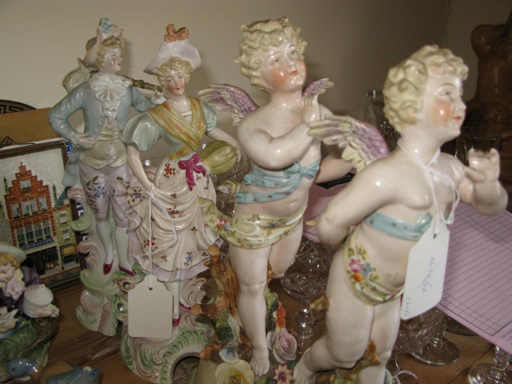 Appraisal: A pair of th Century French porcelain cherubs semi-nude figures