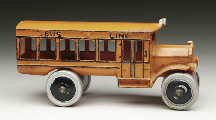 Appraisal: DENT BUS Brightly enameled orange bus with black highlights Silver