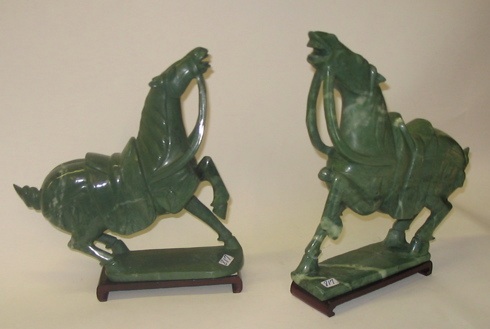 Appraisal: TWO GREEN SERPENTINE FIGURAL HORSES in parade stance Could be