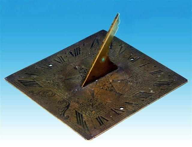 Appraisal: A GEORGIAN BRASS SUN-DIAL the square plate with engraved decoration