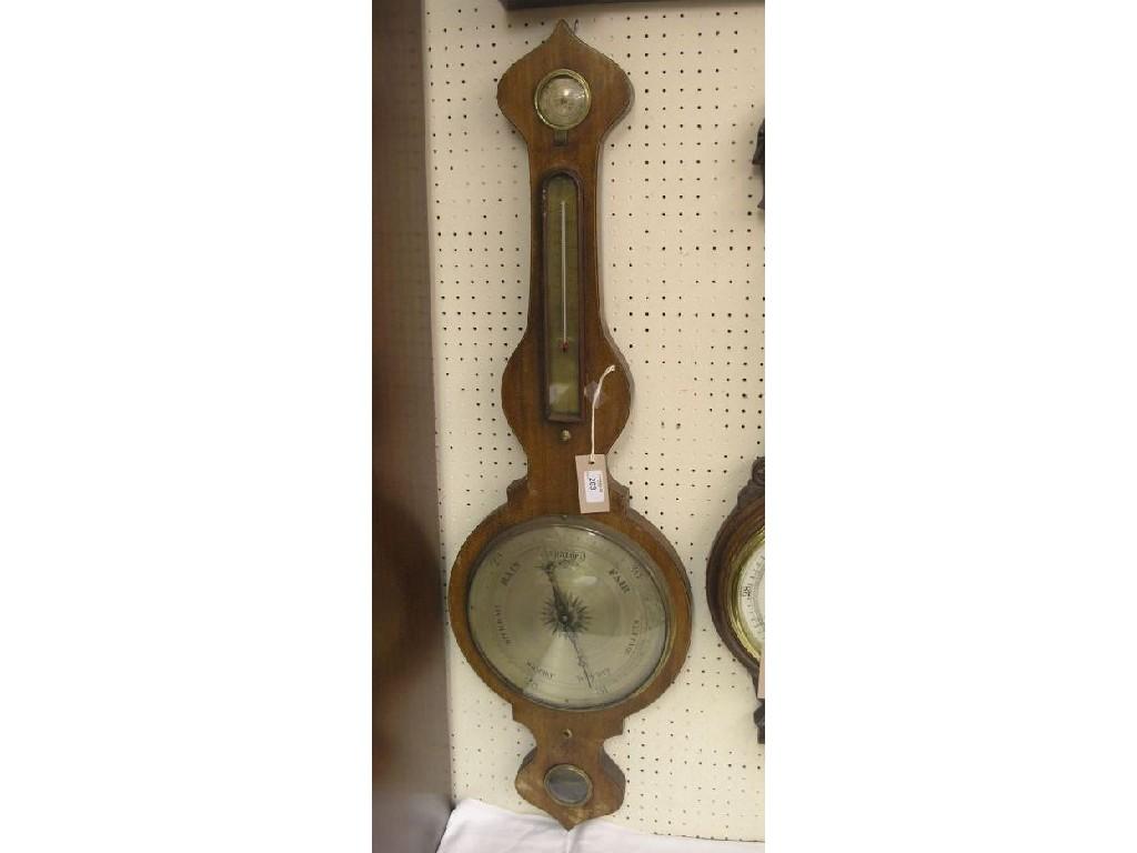 Appraisal: A Victorian mahogany wheel barometer featuring hygrometer thermometer barometer and