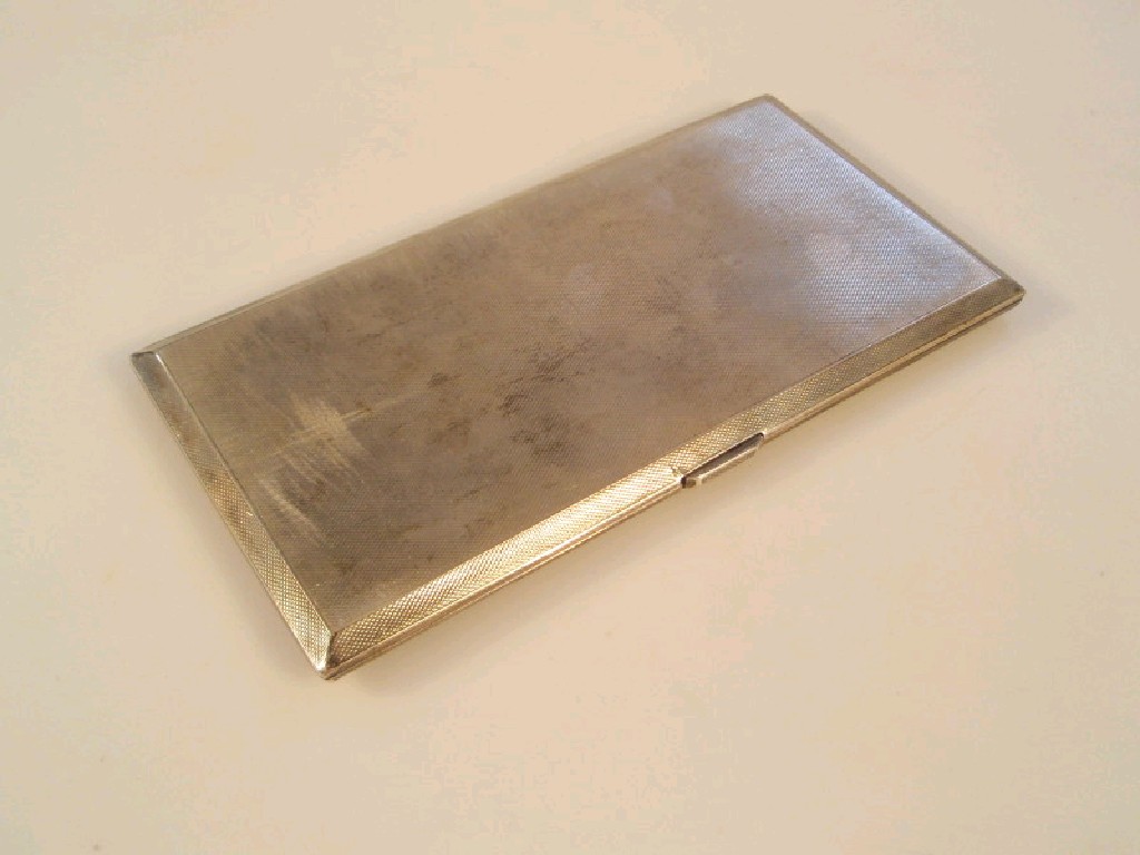 Appraisal: A George VI silver pocket cigarette case with engine turned