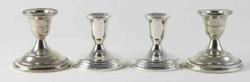 Appraisal: Two Pair of Sterling Candlesticksboth with weighted bases the first