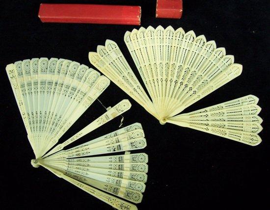 Appraisal: Two ivory bris fans each with finely pierced sticks