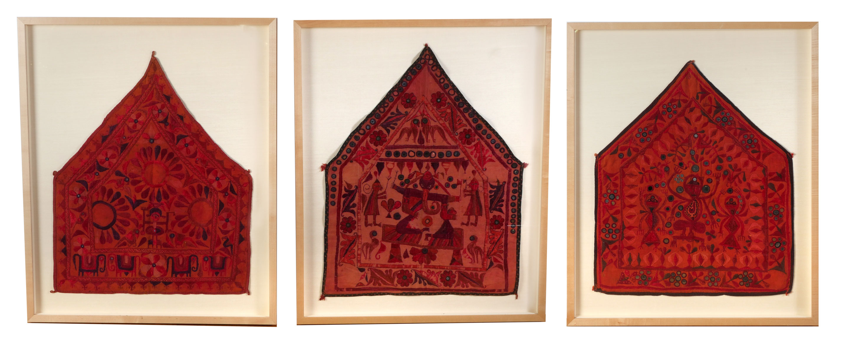 Appraisal: FRAMED ELEPHANT NETTIPATTAMS Red ground with embroidered figures inset circular