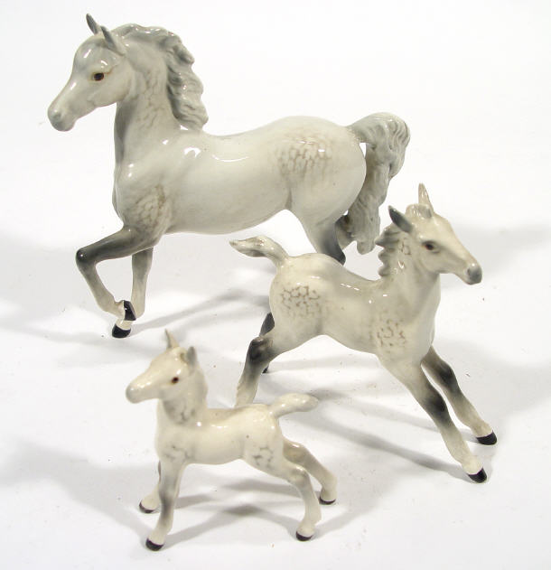 Appraisal: Three graduated Beswick horses each with hand painted grey dappled