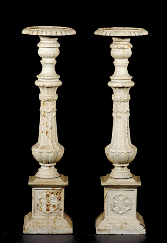 Appraisal: Pair painted cast-iron torcheres turned and lobed baluster with flared