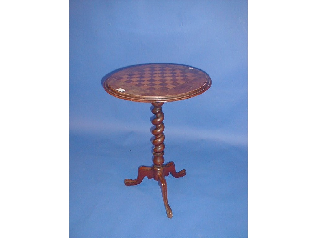 Appraisal: A Victorian walnut tripod table with circular moulded chequerboard top