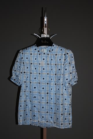 Appraisal: Andr Laug blue square print short sleeve silk blouse Approx