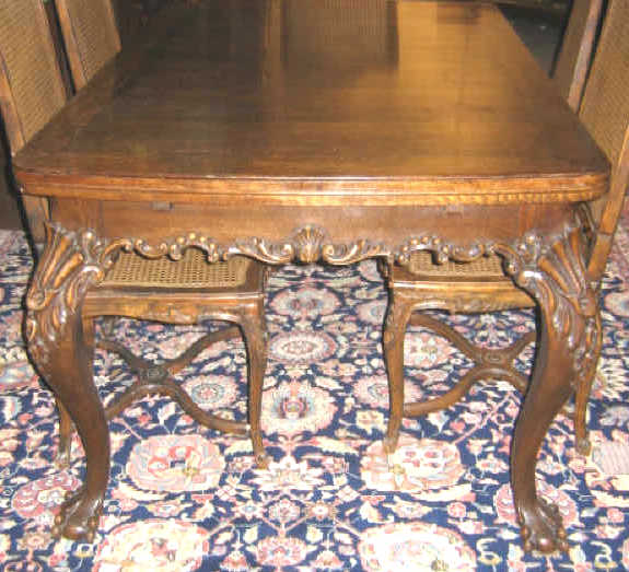 Appraisal: CONTINENTAL OAK DRAW LEAF TABLE The rectangular crossbanded top and