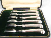 Appraisal: A cased set of six sterling silver handled pistol shaped