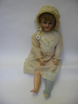 Appraisal: A Simon Halbig bisque head doll with blue sleeping eyes