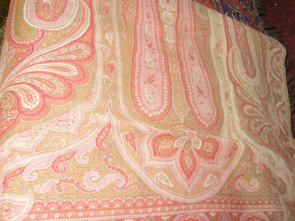 Appraisal: A late th century red ground Paisley wool shawl with