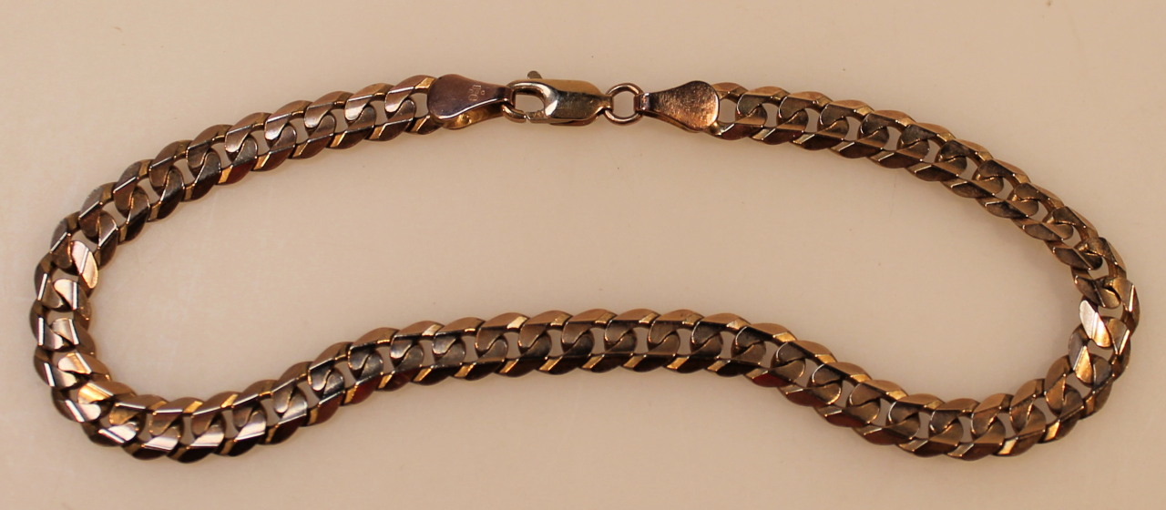 Appraisal: A heavy link bracelet with hook clasp yellow metal marked