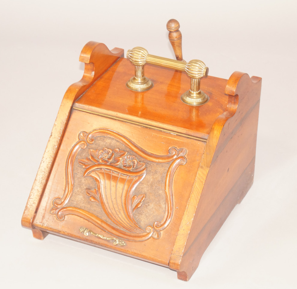 Appraisal: A Victorian walnut coal scuttle with a brass handle and