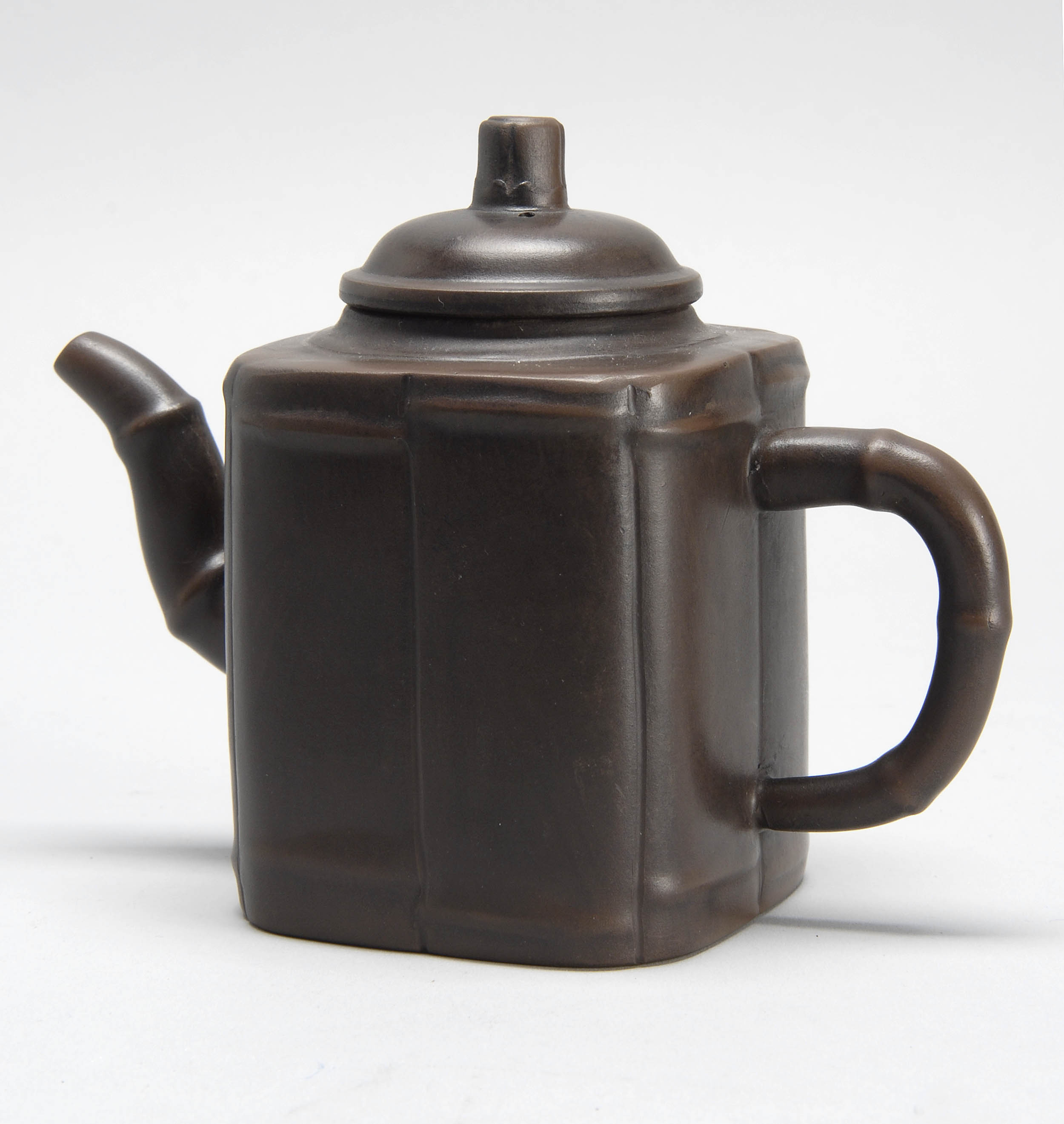 Appraisal: YIXING POTTERY TEAPOT th CenturyIn rectangular form with bamboo-design handle