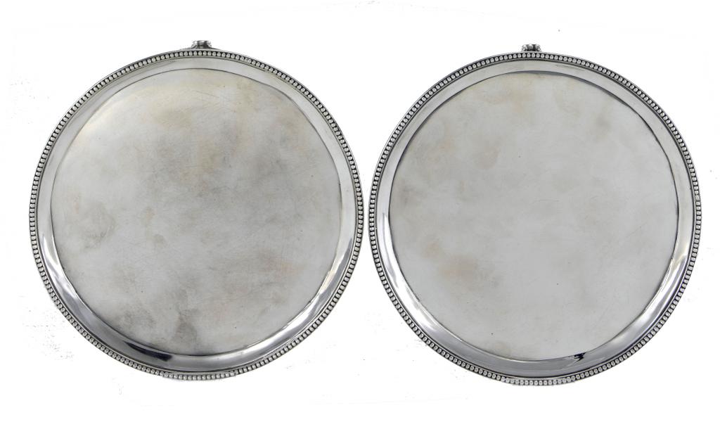 Appraisal: A PAIR OF GEORGE III WAITERS with beaded rim and