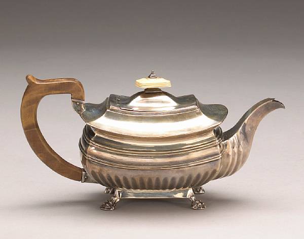 Appraisal: A George III silver teapot with ivory and wooden fittingsAlice