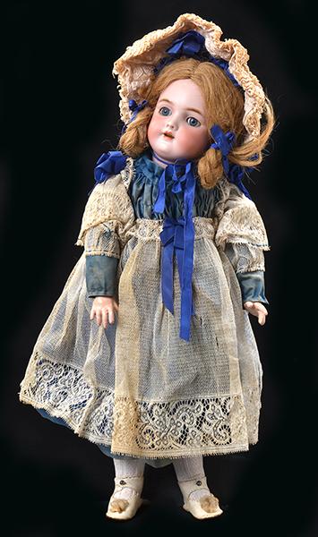 Appraisal: A HEINRICH HANDWORK SEVEN AND A HALF BISQUE HEAD DOLL