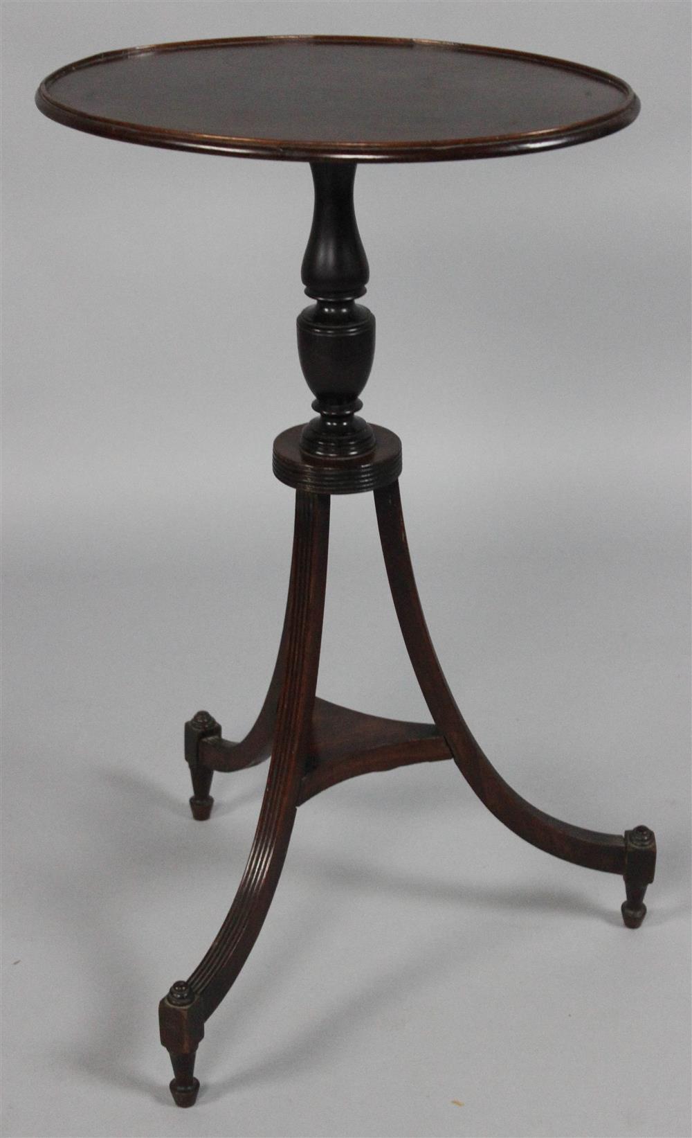 Appraisal: GEORGIAN MAHOGANY OVAL TOP CANDLESTAND in the neoclassical taste having