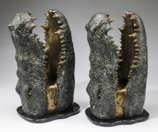 Appraisal: Patinated bronze alligator heads on bases h Pair of patinated