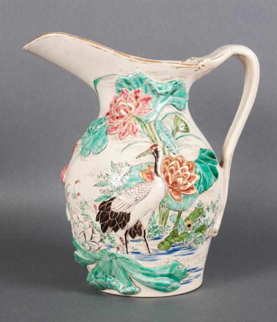 Appraisal: Japanese earthenware pitcher late th century molded bird and floral