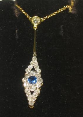 Appraisal: A VICTORIAN SAPPHIRE AND DIAMOND PENDANT comprising flowerhead with sapphire